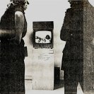 Photograph of spectators watching the screen outside the room for A Change of Plan. (by Tim Burns).