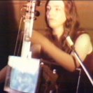 Charlotte Moorman performing the TV Cello in the entrance hall of the AGNSW. 