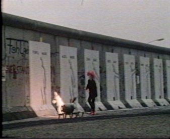 Burning in the silhouettes. The banners for the exhibition are on the wall. 		