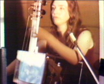 Charlotte Moorman performing the TV Cello in the entrance hall of the AGNSW. 